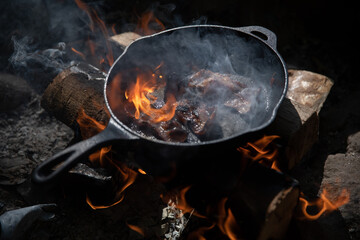Breakfast over a camp fire