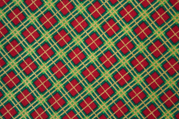 christmas fabric texture with green and red christmas print for december with embroidered and painted decoration