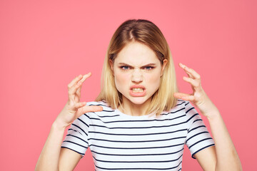 Blonde striped t-shirt emotion gesture hands displeased facial expression pink background