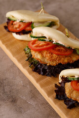 Steamed wheat bun dressed with designer sauce. Vietnamese cuisine concept. Still life. Close-up.