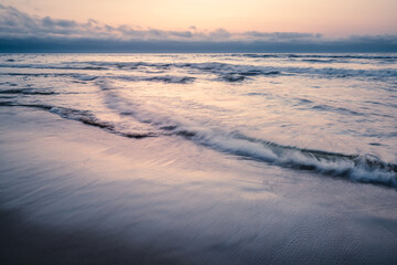 Abstract seascape background, pink sunset over the sea