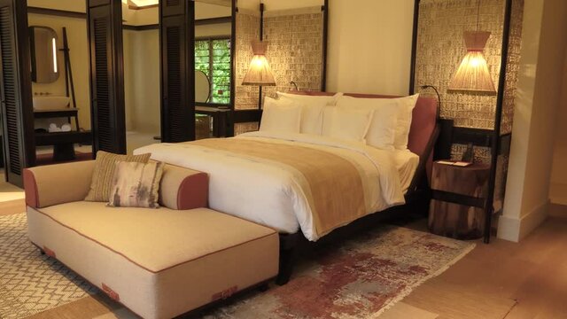 Large double bedroom with elegant wooden d�cor and ensuite