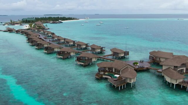 Man-made structures built on shallow atoll in the Idian Ocean for luxury hotel