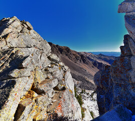 View of mountain landscape from White Baldy and Pfeifferhorn trail, Box Elder and Mill Canyon Peak, American Fork Canyon and Silver Lake in fall, Wasatch Rocky mountain range, Utah, United States. 