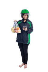 female uber delivery courier wearing helmet bring groceries in the bag