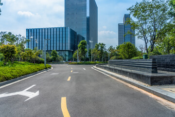 Fototapeta na wymiar clean asphalt road through office block area, suzhou, china