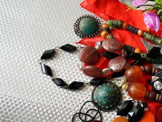 Lots of Indian style jewelry put on the white texture background, for fancy party