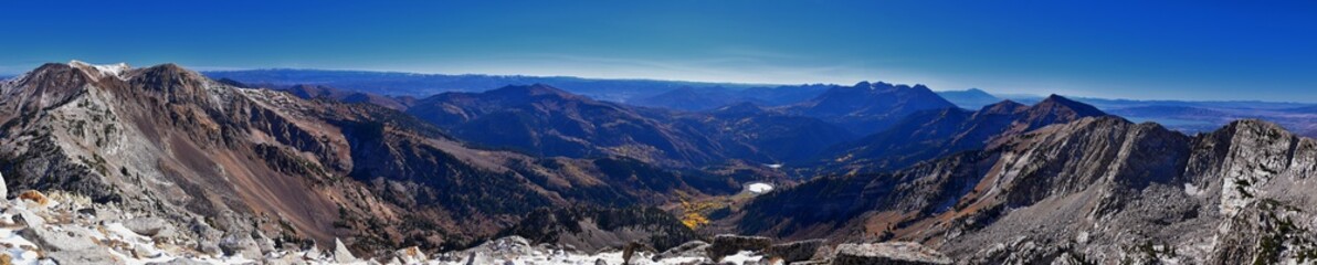 View of mountain landscape from White Baldy and Pfeifferhorn trail, Box Elder and Mill Canyon Peak, American Fork Canyon and Silver Lake in fall, Wasatch Rocky mountain range, Utah, United States. 