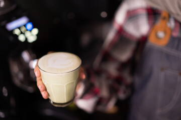 a cup of coffee is ready to be served and drink to customer