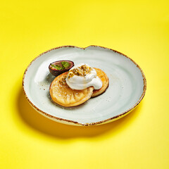 Pineapple slices with maracuya sauce side view
