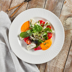 Roasted pepper salad with calamari and fresh greens