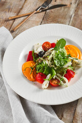 Roasted pepper salad with calamari and fresh greens