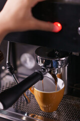 make a coffee with coffee machine in cafe