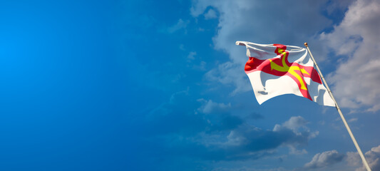 Guernsey national flag with blank text space on wide background.