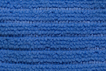 Fabric blue striped background. Soft fiber texture of interlaced polyester. fine grain fabric.