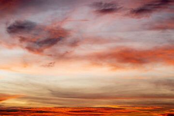 Stratocumulus cold in golden hours orange sky. sunlight through clouds.