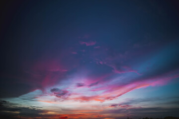 Obraz premium Stratocumulus cold in golden hours orange sky. sunlight through clouds.