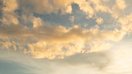 Fototapeta premium Stratocumulus cold in golden hours orange sky. sunlight through clouds.