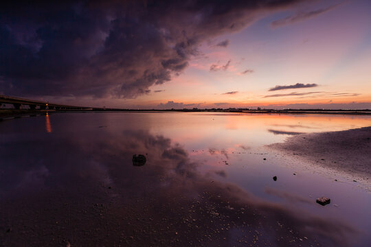 Fiery Clouds and their Reflections at Daybreak