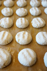 The process of making cheese cakes. Cheesecakes on a baking sheet before baking.