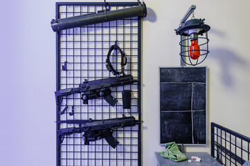 Set of plastic game guns for kids in amusement park, safe shooting range, shooting training