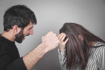 Aggressive man threatens to hit a young girl.