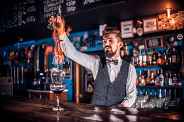 Barman makes a cocktail at the brasserie