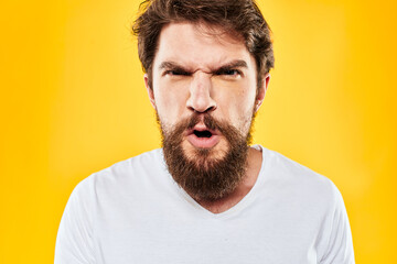 Fototapeta premium bearded man gesturing with hands studio lifestyle discontent yellow background