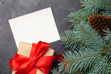 Fototapeta na wymiar Christmas card with fir tree and gift box