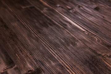 Dark brown wood wood texture background. Roughly processed wood. Close up surface