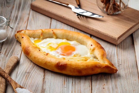 Caucasian flat bread adjarian khachapuri with egg
