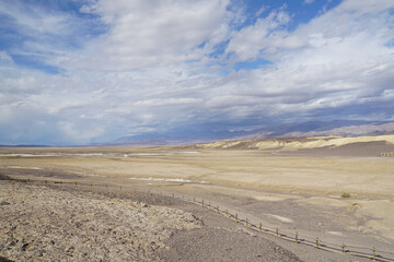 Wide open expanses and terrain at Death Valley National Park on a stormy and cloudy day