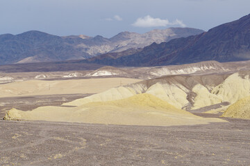 Wide open expanses and terrain at Death Valley National Park on a stormy and cloudy day