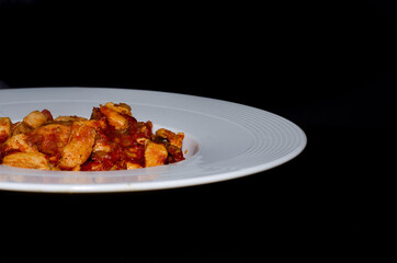 fried chicken saute in white porcelain plate, food, black background