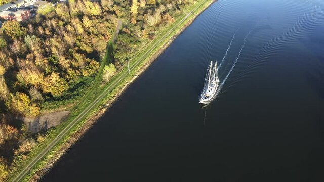 Drone flight top view cruising sailship
