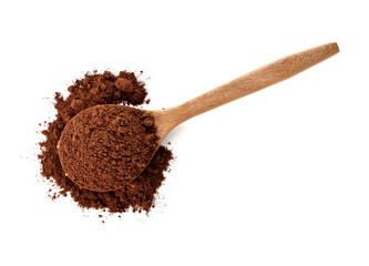 cocoa powder in a wooden spoon isolated on white background