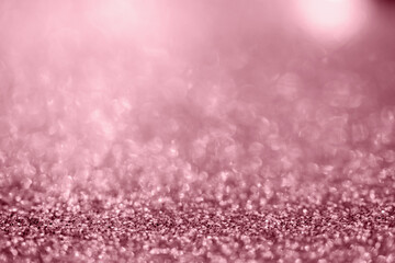 Abstract rose gold glitter sparkle texture with bokeh background