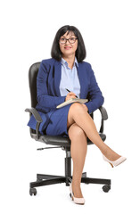 Portrait of female psychologist sitting in armchair on white background