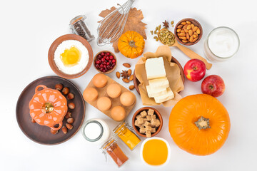 Ingredients for preparing pumpkin pie on white background