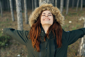 Woman in jacket with closed eyes nature Freedom of travel