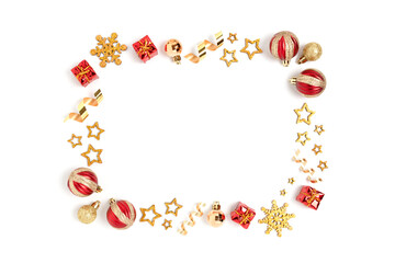 Border frame made of Christmas decorations and confetti on a white background. Holidays composition with copy space.