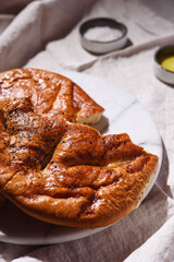 Homemade fresh baked Fougasse (French Bread) with thyme and olive oil on white background. Traditional Provencal dishes. Selective focus