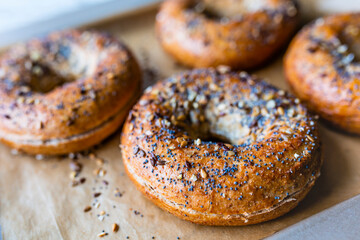 Crispy homemade bagels with sesame and poppy seeds.
