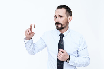 A man looks into the camera an eye holds a drug.