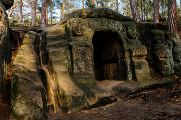 Monument sandstone rock sculptures and Harfenice (Harfenist) cave created by Vaclav Levy between Libechov and Zelizy, Cliff carvings carved in pine forest, Czech republic