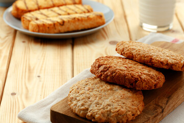 Oat cookies on wooden table close up