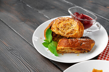 Georgian baked sweet nut roll with berry sauce