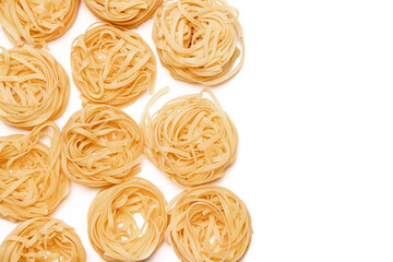 Macaroni nest isolate . Macaroni on a white background. Article about nests pasta dishes.