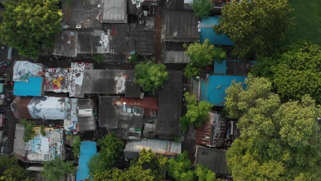 Ascending top view of poor suburbs with old destroyed housing area.Rooftop pattern texture.Third World countries.