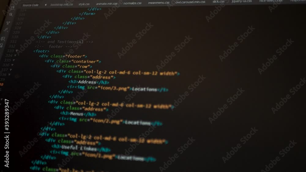 Wall mural developer is browsing html code on the computer screen. html web page code scrolling programming cod